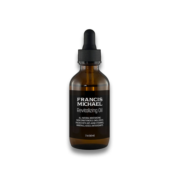 Brown bottle of Francis Michael Revitalizing Oil 2oz with a dropper on a white background