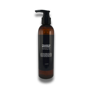 Francis Michael Clarifying Gel in an amber brown bottle with a black pump dispenser and black label, shown on a white background with a soft shadow.