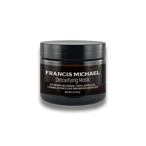 A 2 oz black jar of Francis Michael Detoxifying Mask on a white background with a soft shadow.