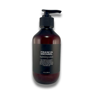 A 6 fl oz amber bottle of Francis Michael Hydrating Lotion with a black pump dispenser and black label, shown on a white background with a soft shadow.