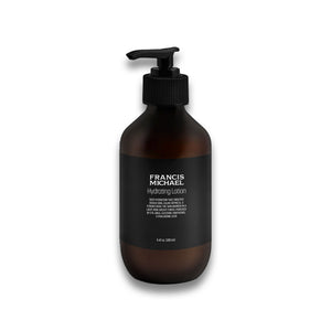 Brown lotion bottle with black pump and Francis Michael Hydrating Lotion on a white background