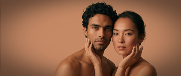 FRANCIS MICHAEL Skincare with two people embracing with a warm, neutral background 