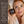 A woman in a white towel holds a jar of Francis Michael Moisturizing Cream next to a text panel that explains the moisturizer's ingredients and benefits.