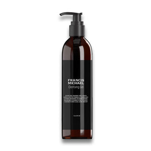Brown bottle with black pump labeled FRANCIS MICHAEL Clarifying Gel on a white background