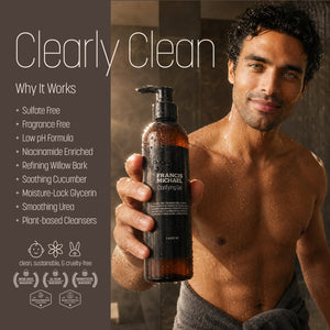 A man holding a bottle of Francis Michael Clearly Clean shampoo, with text on the left detailing the benefits of the shampoo.